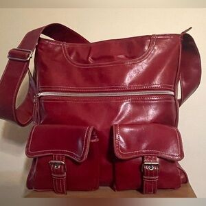 Red women’s faux leather shoulder bag